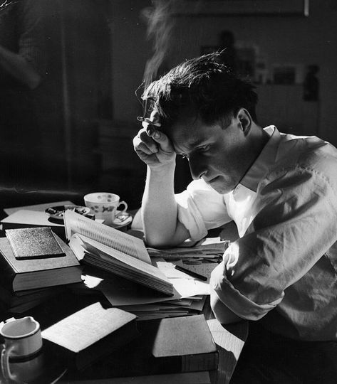 A student reading at his desk, smoking a cigarette, 1956. Photographed by Thurston Hopkins for Picture Post. Man Photography, Human Poses Reference, Human Poses, Character Poses, Photography Poses For Men, Student Reading, Pose Reference Photo, Art Poses, Poses For Men