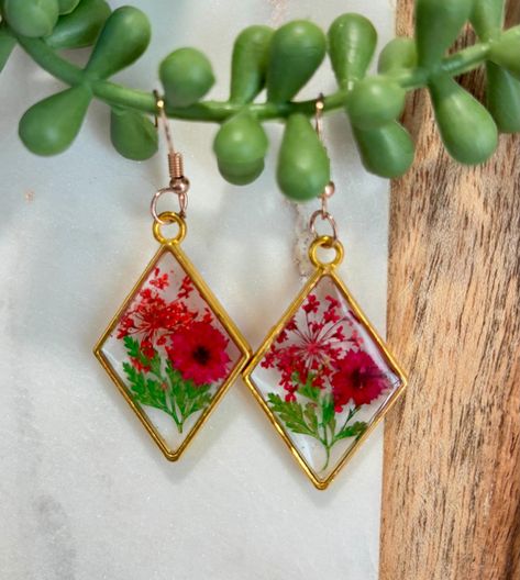 Handcrafted resin earrings in metal bezels with dried and pressed flowers