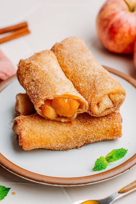 These vegan apple pie egg rolls are filled with soft, gooey apple chunks and coated with a crispy cinnamon sugar topping! Pink Lady Apple Desserts, Pink Lady Apple Pie, Pink Lady Apple Recipes, Pink Lady Apples Recipes, Apple Pie Egg Rolls, Apple Roll, Fried Apple Pies, Homemade Egg Rolls, Vegan Apple Pie