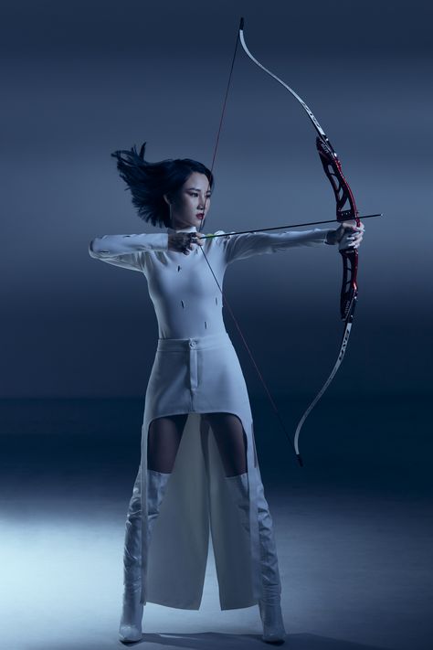 Arrows shooting concept #shooting #arrow #concept #photoshoot #art #artphoto #blueconcept Now And Arrow Pose, Archery Equipment Aesthetic, Shooting Bow And Arrow Pose, Pole Arm Pose Reference, Archery Photoshoot Senior Pics, Bow And Arrow Photoshoot, Person Holding Bow And Arrow Reference, Archer Reference Pose, Bow And Arrow Reference