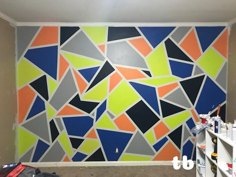 Blue And Orange Accent Wall, Playroom Colours Bright Blue Orange, Navy And Grey Geometric Wall Paint, Red Accent Wall Bedroom Boys, Orange Kids Rooms, Colorful Triangle Pattern Wall, Orange Accent Walls, Room Paint Designs, Green Boys Room