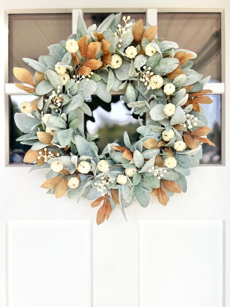 🍂Welcome the crisp, cozy charm of autumn with this neutral fall lambs ear wreath for your front door! If you're looking for more of a simple fall wreath that will fit right in and create a welcoming atmosphere to your home, this is it! Crafted with care, this stunning piece features soft lamb's ear in a soothing neutral hue, bringing a touch of serene elegance to your home. Creamy berries, beige leaves, and mini cream pumpkins are artfully arranged, creating a harmonious blend of textures and c Neutral Fall Garland, Neutral Fall Wreaths, Berries And Cream, Fall Door Decor, Lamb's Ear, Autumn Wreaths For Front Door, Lambs Ear Wreath, Fall Door Decorations, Fall Farmhouse