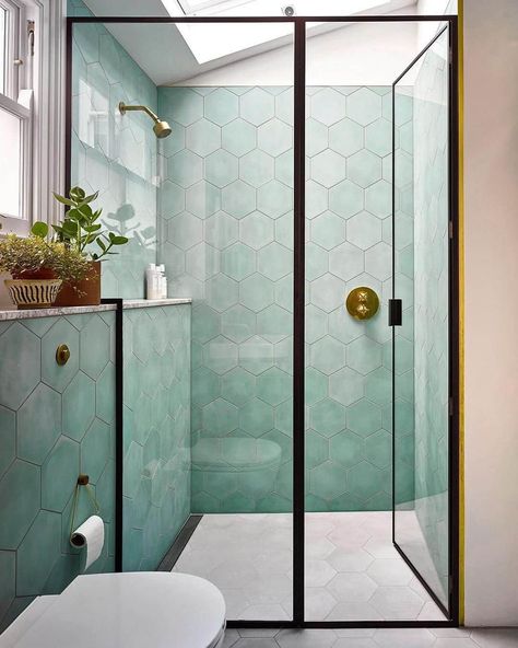 The Best Tile Color for a Small Bathroom 21 Hexagon Tiled Bathrooms, Blue Green Bathroom Tile, Bathroom Remodel Green, Dormer Bathroom, Green Small Bathrooms, Light Blue Tile, Blue Green Bathrooms, Hexagon Tile Bathroom, Blue Green Tile