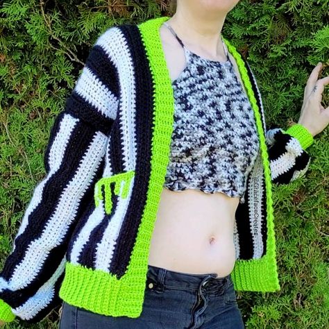 A black and white striped crochet cardigan with neon green trim & slime drips pockets Easy Goth Crochet, Crochet Drip Pattern, Crochet Cardigan Halloween, Free Crochet Patterns Wearables, Spooky Crochet Cardigan, Crochet Pattern Jumper, Halloween Crochet Patterns Free Clothes, Crochet Beetlejuice Cardigan, Halloween Sweater Crochet Pattern