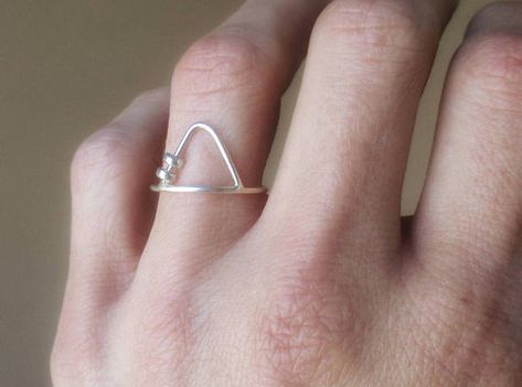 Triangle fidget ring. The 2 little sterling silver beads move along both sides of the triangle, and are 3mm. The sterling silver band is 1mm wide. *Each ring is made to order, and they are all made by hand, so please allow for slight variations. *When ordering, order your regular size. I Fidget Jewelry, Worry Ring, Fidget Rings, Move Along, The Triangle, Spinner Ring, Spinner Rings, Bubble Envelopes, Sterling Silver Bands