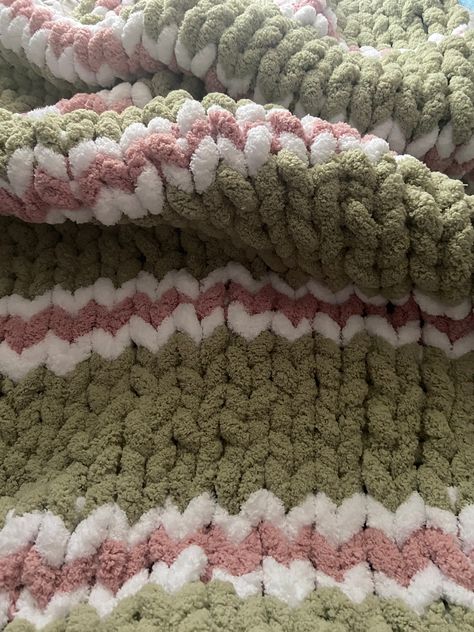 Warm and Cozy Chunky Striped Blanket in Sage Green, Bright White, Chalk Pink is handwoven by me. This blanket is ready to ship and measures approximately W " x L " . colors: Sage Green, Bright White, Chalk Pink, Green, White, Pink materials:  polyester yarn care: handwash and lay flat to dry. cost: the cost of yarn + design and making of the blanket Pink And Green Crochet Blanket, Green Blanket Crochet, Crochet Chunky Blanket Patterns, Weaved Blanket, Crochet Room Ideas, Finger Knitting For Beginners, Sage Green Home Decor, Preppy Bedrooms, Chunky Chenille Blanket