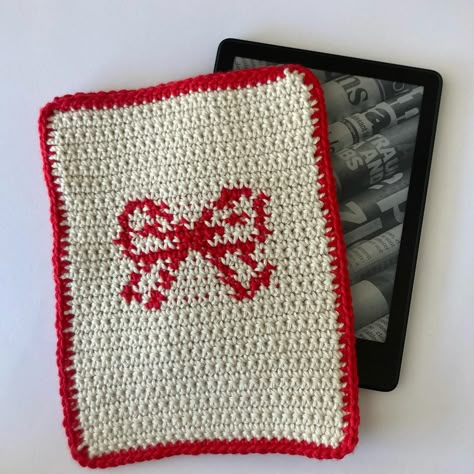 Red Bow Handmade Crochet Kindle Cover/Sleeve Shop Link in Bio #kindle #kindlecover #kindlesleeve #crochet #shoplocal #shopsmall #etsy #etsyshop #melbourne #ereader #booklover Kindle Crochet Cover, Crochet Kindle Sleeve, Kindle Ereader, Ereader Cover, Bow Crochet, Kindle Cases, Nook Glowlight, Crochet Sleeves, Crochet Case