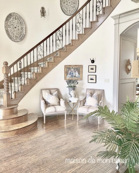 Curved staircase, curved wall  maison de mon coeur. French country French Country Foyer Design, Pictures On Curved Staircase Wall, Decorate Curved Staircase Wall, Curved Stairs Decor, Entryway With Curved Staircase, French Country Staircase Railing, French Farmhouse Staircase, Curved Wall Decor Ideas Foyers, French Style Staircase