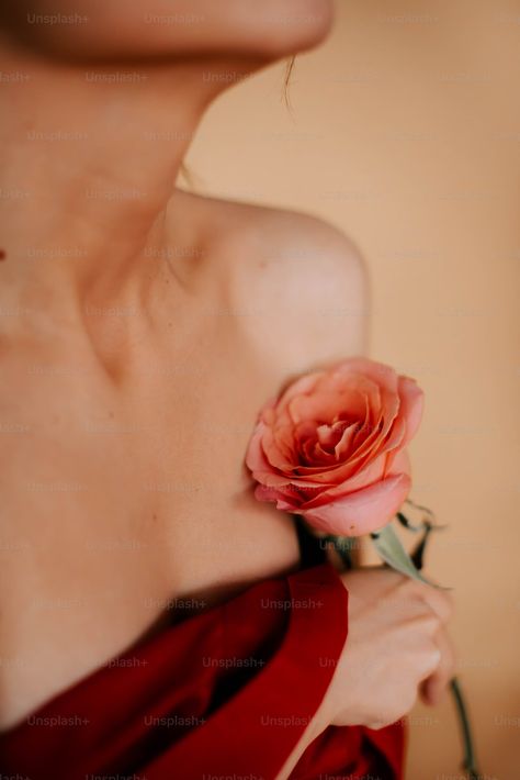 A woman in a red dress holding a rose photo – Posing Image on Unsplash Holding A Rose, Photo Posing, Diy Anniversary Gift, Neck Flower, Photo Lens, Diy Anniversary, Rose Photo, Tan Background, Rose Photos