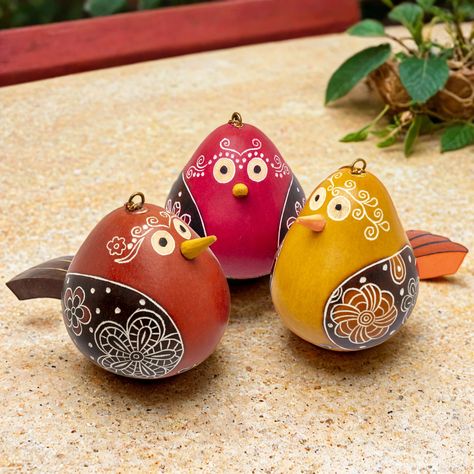 Bring a touch of whimsy and charm to your home all year round with these delightful Flirty Bird gourd ornaments. Perfect for treating yourself or delighting a bird lover in your life! Each bird is full of personality, with its playful beak, tail, and expressive eyes, all dressed up in intricately hand carved rococo-inspired patterns. Created in collaboration and finished with a fire-burning technique by talented gourd master Alejandro Hurtado and his team in Cochas, Peru. Available in three invi Gourd Ornaments, Garden Birdhouses, Mail Gifts, Fire Burning, Expressive Eyes, Bird Lover, Bird Lovers, Gourds, Plant Decor