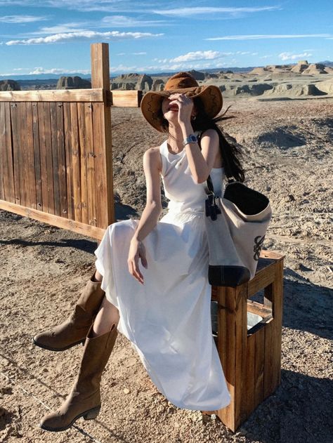 Cowboy Hat Dress Outfit, White Dress With Brown Boots, Long White Dress With Cowboy Boots, White Silk Dress With Cowboy Boots, White Cowboy Boots Outfit Aesthetic, White Dress Brown Boots, Flowy Dress With Boots, Ldr Outfit, White Dress And Cowboy Boots