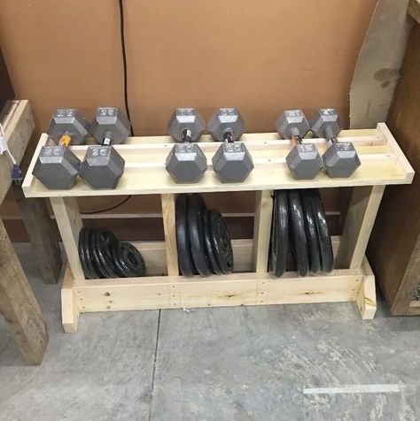 For a simple to build design that can hold both dumbbells and weight plates, consider this DIY design.The rack was created using only 2x6s, scrap plywood and screws. It's a simple way to keep your weights organized without breaking the bank. Exercise Organization, Diy Weight Rack, Diy Dumbbell Rack, Weights Rack, Garage Organization Cheap, Diy Dumbbell, Gym Rack, Home Gym Basement, Diy Gym Equipment