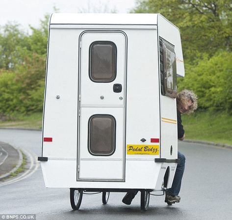 No wing mirrors: Andy looks out the back of his pedal mobile home. He chopped 6ft off the front of a Bedford Bambi campervan and attached it to a Butlins pedal cart before fitting the bespoke interior Bedford Bambi, Bicycle Camper, Stove Table, Bike Camper, Table And Bed, Famous Car, Bicycle Camping, Diy Camper Trailer, Bicycle Trailer