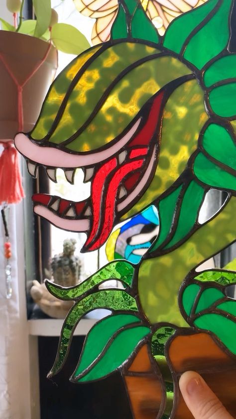 hamboneglass on Instagram: Little glimpse into the making of this Audrey II piece! (And still trying to figure out this reel thing) #struggleisreal Nerdy Stained Glass Art, Glass Staining, Game Symbols, Disney Stained Glass, Audrey Ii, Little Shop Of Horrors, Stained Glass Decor, Stained Glass Ornaments, Stained Glass Diy