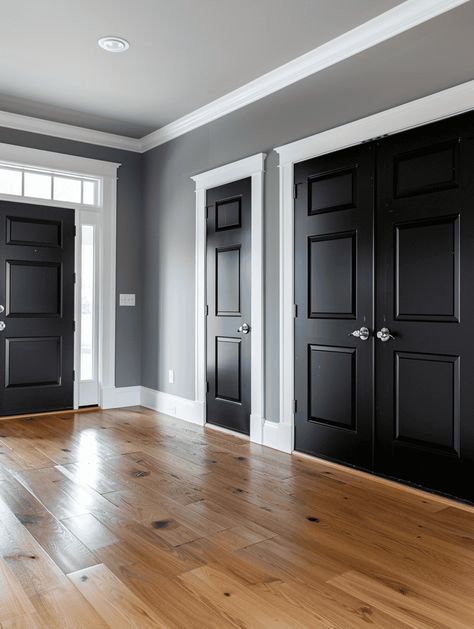 What Color To Paint Interior Doors (6 Suggestions With Pictures) House Trim Colors Interior, Living Room With Black Doors, Grey Interior Paint Schemes, Dark Trim Colors Interior, Gray Walls And Black Doors, Gray Walls With Black Doors, Dark Gray Interior Doors With White Trim, Farmhouse With Black Interior Doors, Dark Color House Interior Design