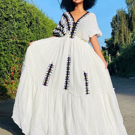 Hand Embroidery Ethiopian Traditional Dress With Modern And Simple Style For The Chic Look Habesha Kemis Ethiopian Dress, Simple Ethiopian Traditional Dress, Festive White Embroidered Habesha Kemis, Festive Bohemian Embroidered Habesha Kemis, Traditional White Embroidered Habesha Kemis, Traditional Festive Habesha Kemis Handloom, Festive Folk-style Habesha Kemis, Cream Maxi Dress, Ethiopian Clothing