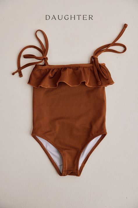 Make childhood Summer memories all the more sweet with our Maja Swimsuit in Cinnamon. Featuring an adorable ruffle detail and dainty tie-up straps, making it the perfect choice for your little one's beach adventures. #KidsSwimwear #BeachyKids #KidsFashion #Swimsuit #Bows #BowDetails #KidsAndBows Childhood Summer, Kids Sand, Sea Colour, Beach Adventure, Summer Memories, Kids Swimwear, Beautiful One, Kids' Fashion, Sunny Days