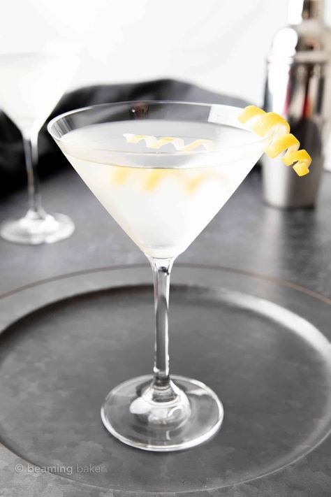 Enjoy the classic flavors of the classic martini, made with this easy recipe with vodka or gin. It's so simple and easy to make! | Recipe at BeamingBaker.com Best Martini Recipes, Business Drinks, Cocktails Made With Vodka, Martini Recipes Vodka, Cocktail Tools, Olive Brine, Recipe For 1, Classic Martini, Aromatic Bitters