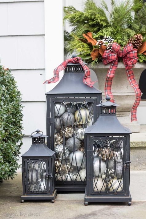 Love the idea of filing lanterns with ornaments to decorate your porch for Christmas! Holiday Lantern Ideas, Lanterns For Christmas, Porch Lantern, Driven By Decor, Lantern Ideas, Christmas Table Centerpieces, Simple Christmas Decor, Christmas Lanterns, Beautiful Christmas Trees