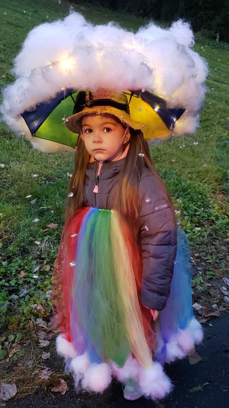 Lighted rain cloud with hanging, beaded prism raindrops. Tulle rainbow gown with cloud puff hem. 🌧🌈 #homemade #kidscostume #halloween #costume #rainbow #raincloud #cloud #diy #somewhereovertherainbow #stormcloud Rainbow Cloud Costume, Rainbow Costume Kids, Rainbow Costume Diy, Rainbow Gown, Rain Cloud Costume, Tulle Rainbow, Cloud Diy, Rainbow Halloween Costume, Rain Costume