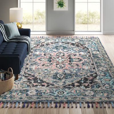 This Oriental rug features an intricate center medallion and border, with ornate floral motifs inspired by Persian rug designs. It comes in vibrant pink and blue tones that put a modern spin on a boho look. Hand-tufted from wool and cotton, this indoor rug shows off multicolored tassels on both ends for a fun, eclectic vibe. Its plush 0.51" pile height makes it ideal for rooms with low foot traffic, like your bedroom or home office. Plus, it's safe to roll out over heated floors. Even with a cot Pink And Gold Office, Blue Home Offices, Persian Rug Designs, Rug Designs, Cotton Area Rug, Gold Rug, Heated Floors, Navy Rug, List Ideas