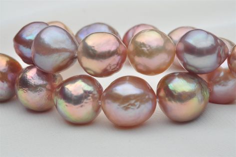 Natural Rainbow Color Baroque Pearl Strand,Natural Mixed Color Baroque Pearl String! Pearl type: freshwater nucleus pearls Pearl size: 9-11mm Surface: has minor growth textures and some blemishes. Very beautiful! Luster: High Color: Natural metallic color Length: 16 inches as loose pearl strand. Stringing service is available if you are looking for a finished pearl necklace. Around 18 inches after stringing into a finished necklace with the clasp included.38 pearl beads in the strand. Pearl Lowe, Real Pearl Jewellery, Pearl Beading, Rainbow Pearl, Pearl Strand, Loose Pearls, Green Pearls, Jewelry Lookbook, Natural Rainbow