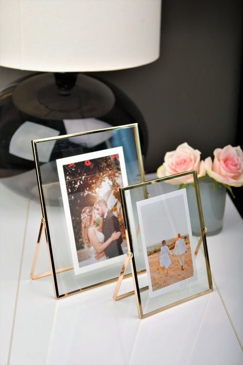 An elegant freestanding table picture frame with uv print on the glass. (names, hashtags, your brand). Also a perfect gift. Gold freestanding photo frame 20cm/8in (H) x 15cm/6in (W) x 1cm/0,5in (D) or 25cm/10in (H) x 20cm/8in (W) x 1cm/0,5in (D) Pack includes 1 frame without photo. Picture Frame Display On Table, Photo Frame On Table, Glass Frame Photo, Table Picture Frame, Photo Frame Table, Wedding Photo Frame, Forest Essentials, Small Photo Frames, Picture Table