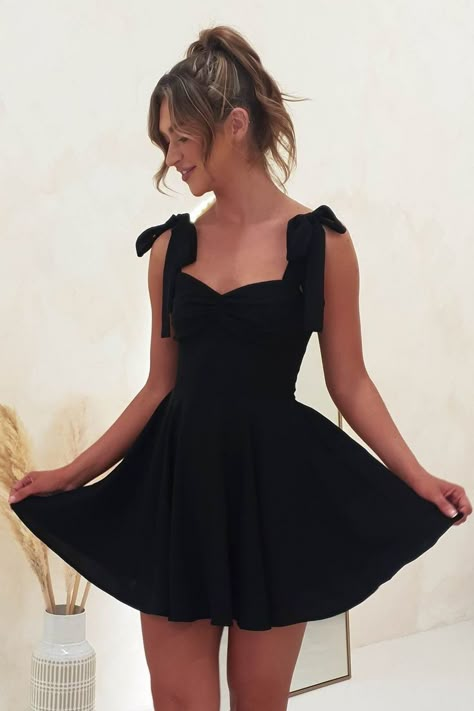 You will still look amazing whether you go for plain dresses, sequin dresses, or glitter dresses, especially in black. Whatever the style, as long as it's black, will work. You are a timeless fashion statement. Everything about black dresses is charming and will draw people to you. We will have the nicest black dresses for you here at Couture Candy. Buy now! Tie Strap Formal Dress, Short Dresses For Wedding Guests, Cute A Line Dresses, Black 8th Grade Graduation Dresses, Black A-line Dress, Mini Dresses Wedding Guest, Short Black Graduation Dresses, Cute Mini Prom Dresses, Short Summer Dresses For Wedding Guest