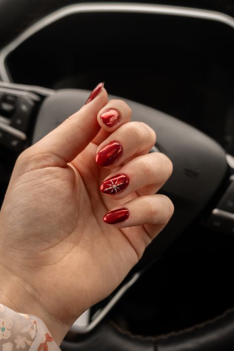 My nail girl NEVER misses! This is gorgeous red chrome nails with a little snow flake accent nail on the ring finger. Christmas Nails Simple Almond Shape, Red Nails With Accent Nail Christmas, Christmas Nail Ideas Chrome, Red Chrome Snowflake Nails, Red Nails With Red Chrome, Red Snowflake Nails Short, Christmas Red Gel Nails, Holiday Accent Nail, Red Nails With Christmas Tree