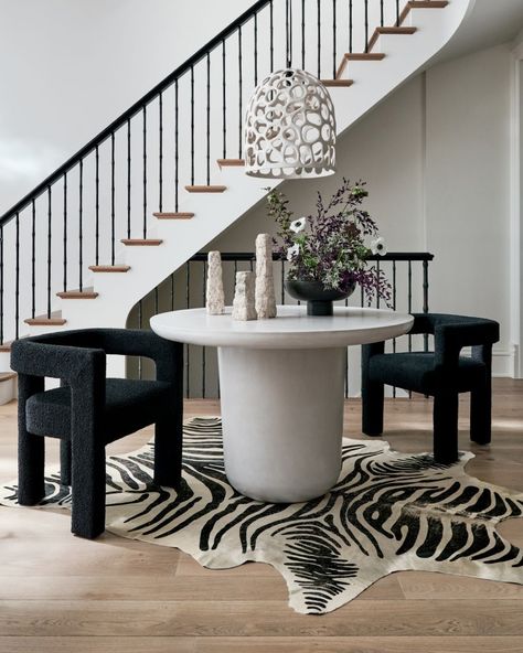 CB2 on Instagram: “when your dining table can double as an entry table and vice versa 🙌” Round Concrete Dining Table, Tattoo Modern, Zebra Hide, Fabric Lounge Chair, Concrete Dining Table, Black Chair, Entry Table, Dining Arm Chair, Table Seating