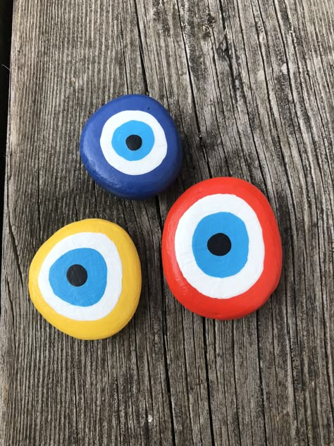 Evil Eye Rock, Evil Eye Painted Rocks, Evil Eye Rock Painting, Evil Eye Diy, Tulip Decor, Evil Eye Art, Painted Pebbles, Diy Rock Art, Stone Art Painting