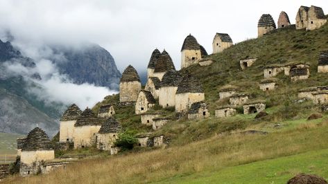 Just outside the remote Russian village of Dargavs, a medieval necropolis holds the remains of more than 10,000 people (Credit: dane-mo/Getty Images) Russian Village, Moscow Travel, Shungite Stones, Dangerous Roads, Caucasus Mountains, Ancient Artifacts, Graveyard, 16th Century, Cologne Cathedral