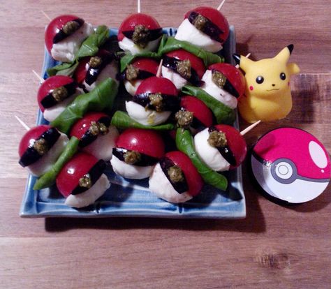 Pokemon Ball appetizer of organic cherry tomatoes, fresh basil from my garden, Ciliegine baby Mozzarellas, black kalamata olives & Genova pesto. Pokemon Appetizers, Pokemon Ball, Pokemon Party, Kalamata Olives, Fresh Basil, Caprese Salad, Cherry Tomatoes, Mozzarella, Pesto