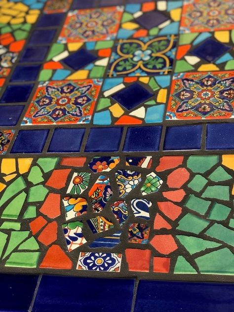 Partial close up of mosaic table top detail using Mexican talavera tiles Mexican Mosaic Tiles, Talavera Table Top, Talavera Mosaic, Talavera Table, Making A Mosaic Table Top, Mexican Mosaic, Mexican Tile Table, Mosaic Rectangular Table Top Patterns, Mosaic Garden Ideas