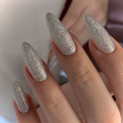 Almond Nails Winter Colors 2023-2024: 17 Trendy and Cozy Ideas - thepinkgoose.com Almond Nails Winter Colors, Silver Sparkly Nails, Almond Nails Winter, White Almond Nails, Silver Glitter Nails, Cozy Ideas, Summer Toe Nails, French Acrylic Nails, Almond Acrylic Nails