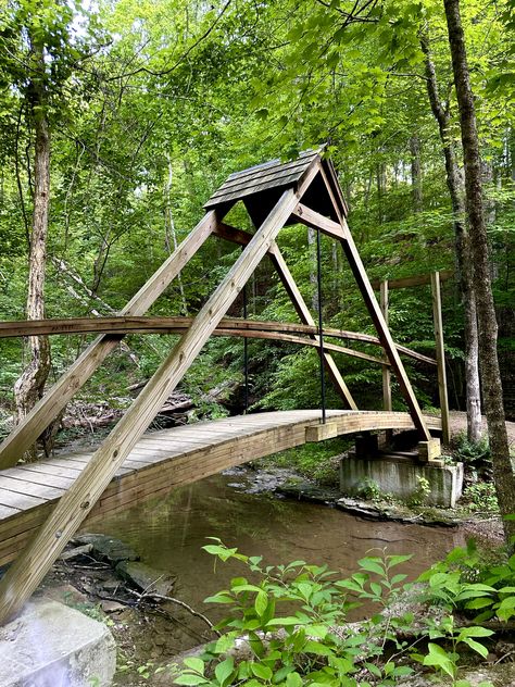 May 26, 2023 Small Bridge Over Creek, Yard Bridge, Stone House Revival, Garden Bridge Design, Backyard Bridges, Outdoor Improvements, Wood Walkway, Framing Construction, Outdoor Steps