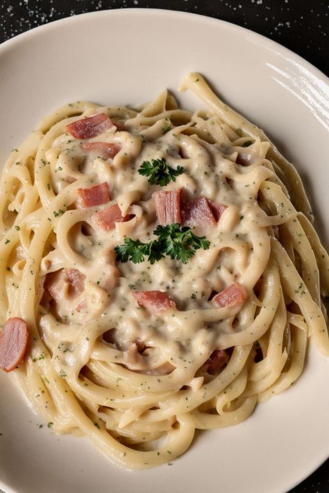 Carbonara Sauce With Cream Recipe

Ingredients

- 1 cup heavy cream
- 1/2 cup grated Parmesan cheese
- 4 ounces pancetta or bacon, diced
- 2 large egg yolks
- Salt and black pepper to taste
- 2 cloves garlic, minced
- Fresh parsley, chopped (for garnish)

Instructions

- In a large skillet over medium heat, cook the pancetta or bacon until crispy. Add minced garlic and sauté for another minute.
- In a bowl, whisk together the heavy cream, egg yolks, Parmesan cheese, salt, and black pepper until smooth.

Full Recipe on... Carbonara Recipe With Cream, Carbonara With Cream, Spaghetti Carbonara With Cream, Cabonara Recipes, Carbonara Sauce Recipe, Carbonara Pasta Creamy, Easy Carbonara, Creamy Carbonara Sauce, Fettuccine Carbonara