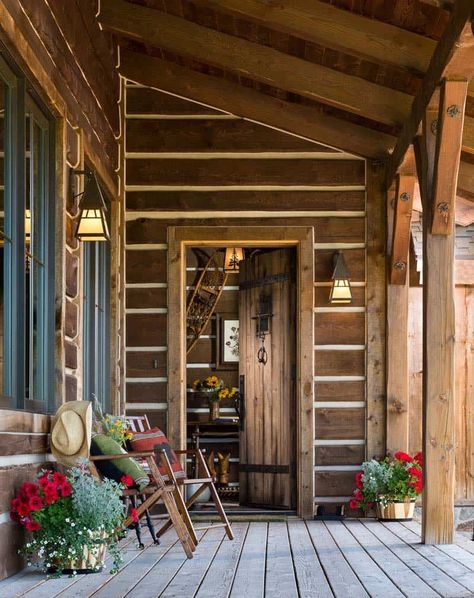 The exterior facade of this timber frame cabin features local beetle- kill siding, which was handcrafted. To give an authentic log cabin look, darker logs with chinking were selected. Log Cabin Exterior, Timber Frame Cabin, Timber Frame House, Structural Insulated Panels, Cabin Exterior, Timber Frame Homes, Log Cabin Homes, Steamboat Springs, House With Porch