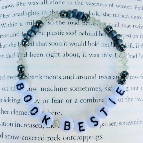 A beautiful, stretchy, easy-to-wear bracelet for book lovers . Crafted quality Japanese seed beads,  and pretty crystals, this stunning and stackable bracelet is the perfect gift a book lover, and your besties in your book club.  Handcrafted with love by a book loving English teacher. 📚 Book Friendship Bracelet, Bookish Bracelet Ideas, Bracelet Ideas Letters, Bookish Friendship Bracelet, Bookish Bracelet, Book Bracelets, Bracelet Letters, Book Bracelet, Pretty Crystals