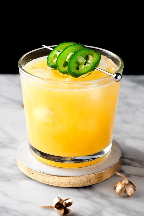 This Pineapple Mezcal Cocktail is a fancy craft cocktail that has a bit of a spicy kick. Made with homemade jalapeno simple syrup, this is a cocktail that will impress your guests. Best Mezcal Cocktail, Jalapeno Syrup, Mango Jalapeno Margarita, Basic Cocktails, Unique Cocktail Recipes, Spicy Drinks, Mezcal Cocktails, Drink Syrups, Cooking With Beer