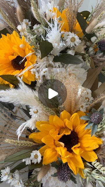 Kate Hindley | Blooming Artificial on Instagram: "Sunflower themed wedding flowers completed today.  I loved making these as sunflowers are my happy flower.  They’re so bright and cheerful 🌼  These flowers are a mix of artificial, dried and preserved.   #sunflower #wedding #bohoweddding #rusticwedding #autumn #autumnwedding #fall #fallwedding #bouquet #sunflowerbouquet #pampas #grasses #driedflowers #preservedflowers #artificialflowers #wheat #barley  #daisy #thistle #handmade #bespoke #smallbusiness" Pampas Grass And Sunflower Wedding, Pampas Grass Sunflower Centerpiece, Pampas Grass And Sunflowers, Diy Sunflower Wedding Bouquet Fake Flowers, Sunflower And Wheat Bouquet, Sunflower Wheat Bouquet, Sunflower Arrangements, Sunflower Themed Wedding, Sunflower Bouquets