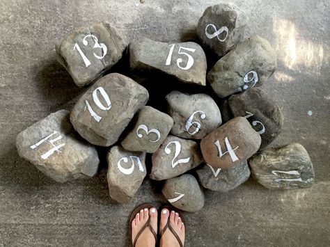 Rock table numbers. www.signedbym.co Rock Table Numbers, Wedding Signage Chalkboard, Gala Planning, September Wedding Ideas, Rock Table, Island Wedding Ideas, Wedding Chalk, Table Number Ideas, Number Ideas