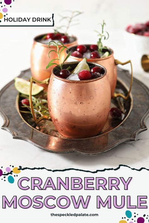 The Cranberry Moscow Mule is a lovely Christmas sipper. Also known as a Yule Mule, this twist on the classic cocktail highlights cranberry juice! #EasyEntertaining #HappyHour #SpeckledPalate Cranberry Moscow Mule Recipe For A Crowd, Cranberry Orange Moscow Mule, Yule Mule, Huckleberry Moscow Mule Recipe, Moscow Mule Cranberry, Cranberry Moscow Mule, Beer Cocktail Recipes, Cranberry Drinks, Fun Party Drinks