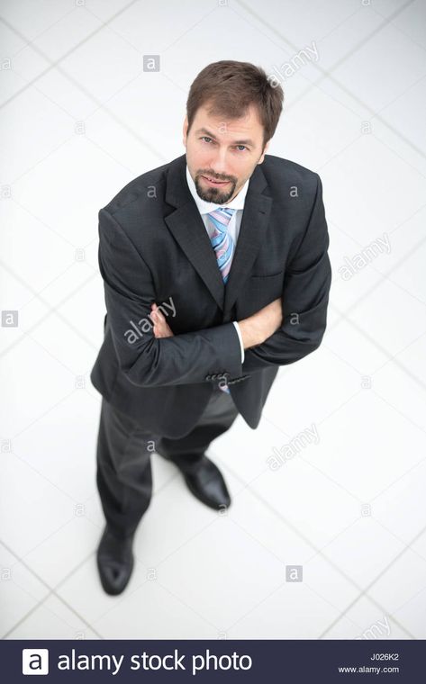 Download this stock image: Happy middle aged man standing and looking at camera. Top view. - J026K2 from Alamy's library of millions of high resolution stock photos, illustrations and vectors. Man Looking Up, Image Happy, Middle Aged Man, Man Standing, Image Processing, Business Person, Top View, Middle Age, Business Man