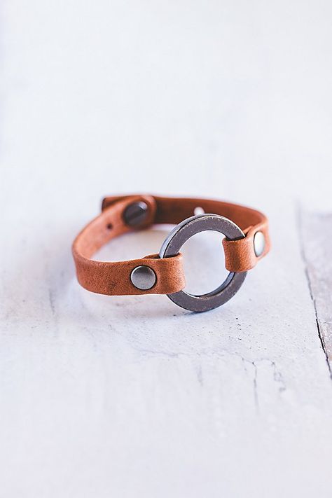 Designed to remind us that we all need to reconnect and ground to nature, our Grounding bracelet is handcrafted from the softest lamb leather and features a chunky antique silver ring with matching rivets. **Contents** * Lambskin leather, zinc alloy hardware * Button clasp closure * Handmade **Care/Import** * Made in the USA **Dimensions** * Adjustable to fit wrist sizes 6.5”-8” | Giving Bracelets Antique Silver Grounding Leather Bracelet at Free People in Orange Leather Bracelet Diy, Boho Leather Jewelry, Rivet Jewelry, 2024 Creative, Leather Bracelet Tutorial, Leather Cord Jewelry, Diy Leather Bracelet, Leather Accessories Handmade, Leather Cord Bracelets