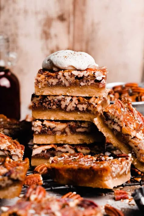 Pecan Pie Bars taste just like a slice of rich, gooey pecan pie without the fuss of pie crust! A delicious maple pecan pie filling is baked atop a crisp cinnamon shortbread crust. Top with a sprinkle of flaky sea salt and a dollop of freshly whipped cream for a crowd-pleasing Thanksgiving dessert. Blue Bowl Apple Bars, Blue Bowl Pecan Pie Bars, Salted Maple Pecan Pie Bars, Maple Pecan Desserts, Pie For A Crowd, Pecan Pie Cake Recipe, Pie Cake Recipe, Pecan Desserts Recipes, Maple Pecan Pie