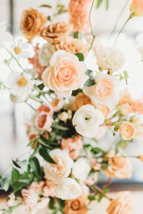 This floral arrangement is full of beautiful peachy tones that are perfect for your spring wedding! | florist, dc florist, flower bouquet, floral arrangement ideas, floral arrangements, peach flowers, wedding flowers, flower bouquets, floral arrangement, neutral wedding flowers, bouquet wedding, bouquet flowers, bridal bouquet flowers, bridal bouquet flower, 2023 wedding, DC florist, DC wedding, wedding ideas, wedding decor, wedding inspiration, orange flower, wedding colors, white flowers Summer Flowers Wedding, Peach Wedding Centerpieces, Cream Wedding Flowers, Neutral Wedding Flowers, She Loves Me, Florist Wedding, Bridal Bouquet Flowers, Peaches And Cream, Cream Wedding