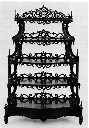 This is an example of etagere furniture; a piece of furniture made up of several shelving units made to fit small objects. This piece of etagere furniture has four shelving units that are spaced close together. Gothic Bookcase, Goth Houses, Gothic Bedroom, Gothic Furniture, Goth Home, Goth Home Decor, Style Gothic, Dark Home, Goth Decor