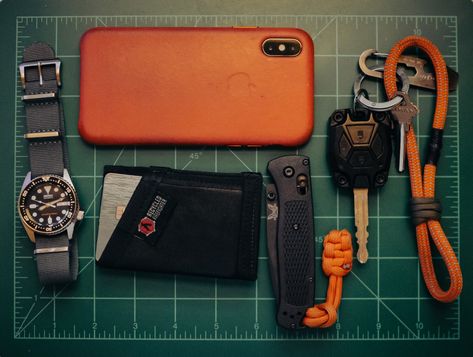 submitted by Vy NguyenSeiko SKX013Hodinkee Grey Nato Watch StrapRecycled FireFighter Tarp Sergeant WalletBenchmade Mini BugoutApple Leather iPhone XS CaseAJT DESIGN Injection Fob CaseNite Ize DooHicKeyCustom paracord keychainAs I'm writing this, I see that I didn't take the time to line up all of my objects perfectly. My OCD is telling me to delete this entire post and re-do the photo, but for the sake of utilitarianism and spirit of the, "pocket dump," I'll leave it as be. The re Pocket Dump, Travel Collection, Everyday Carry, I Fall, Firefighter, Sake, Everyday Essentials Products, Color Pop, Leather