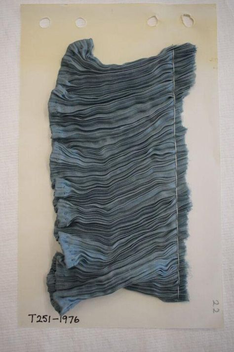 Made 1920-1929 and designed by Fortuny. This fabric is blue silk pleated by Fortuny's method. The hem is sewn with matching blue silk. Runway Moodboard, Decay Textiles, Water Textiles, Fabric Moodboard, Fortuny Pleats, Fortuny Fabric, Mariano Fortuny, Fashion Design Classes, Aesthetic Dress